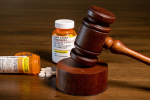 Pharmaceutical Liability pill bottles and judge's gavel