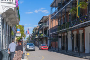 New Orleans Street with pedestrians and cars